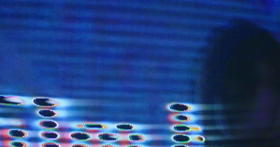 A woman is shown on a digital display