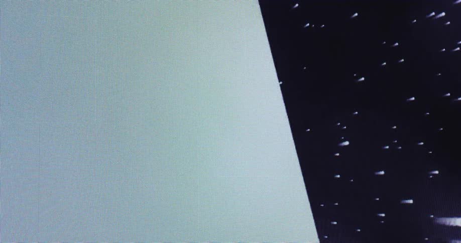 A white digital cube rotating and flying through space