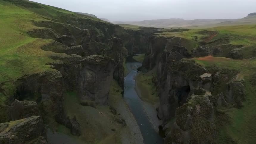 River flowing through a grassy canyon