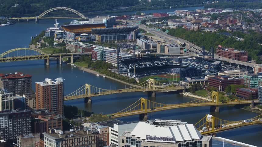 Arial view of a city and its bridges and stadiums in sight
