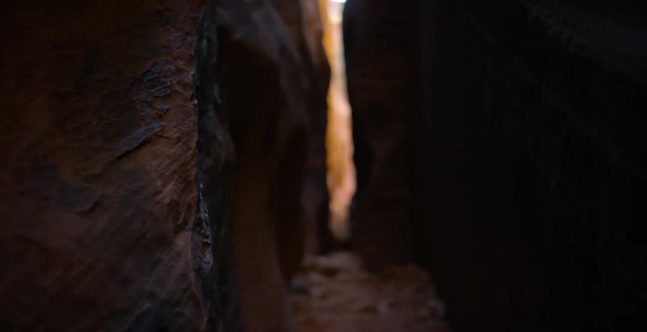 Walking through a narrow canyon in the middle of the day