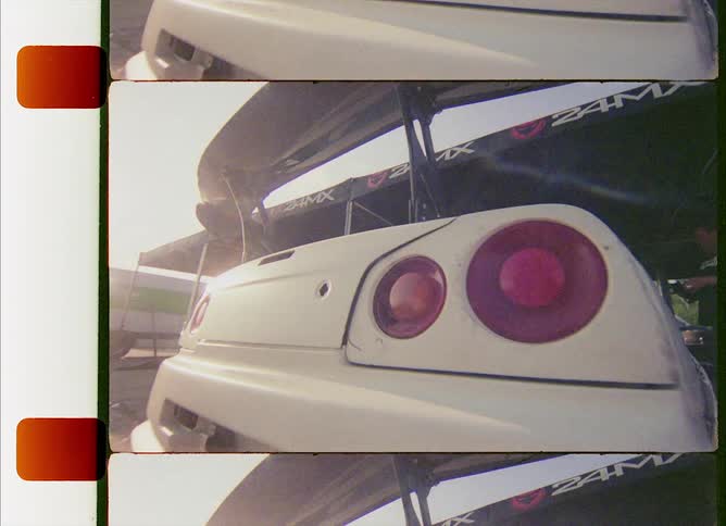 Close up of a racing car with a big spoiler on the back