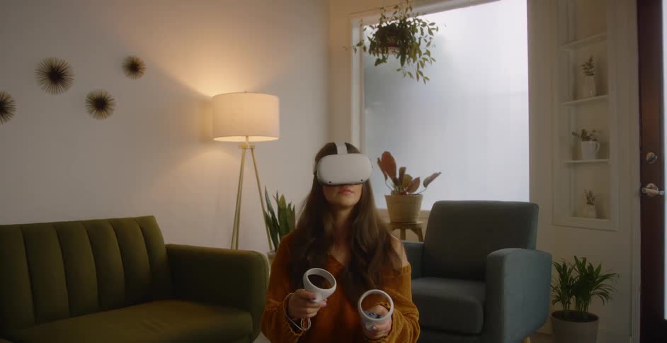 A woman using a virtual reality headset at home in a living room