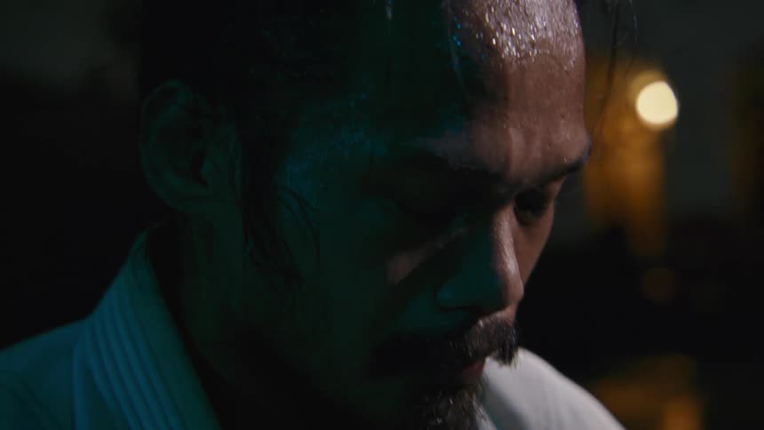 A man i sweating and taking a breather