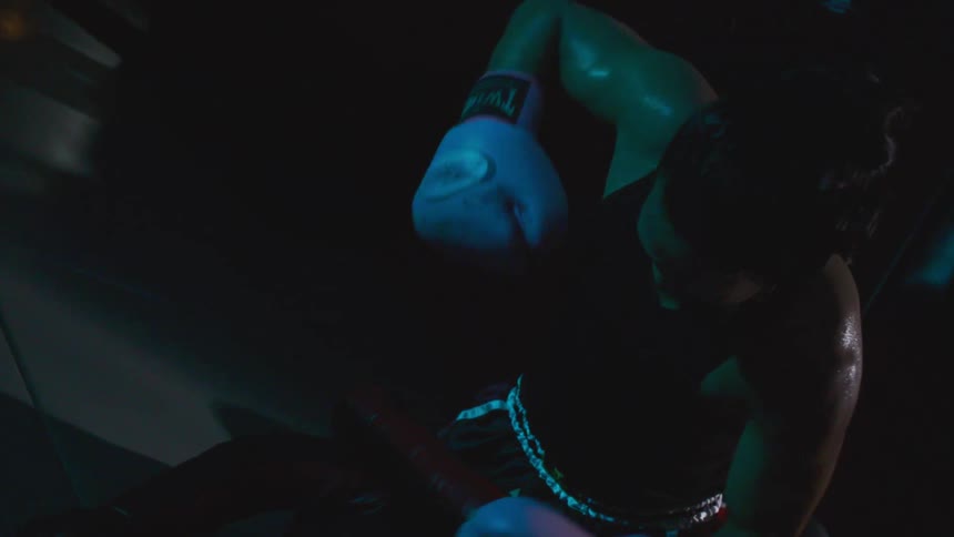 A pan punching a training doll