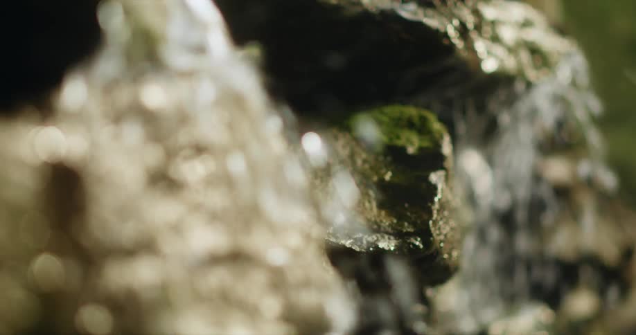 A view of a small waterfall flowing over rocks