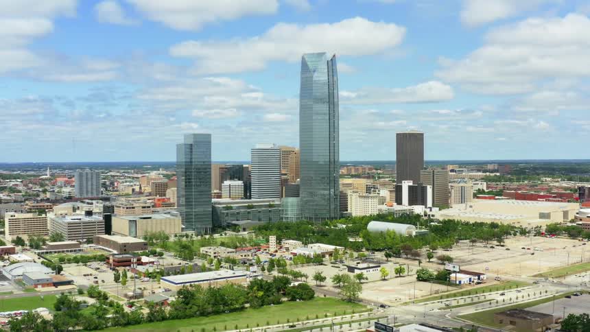 Aerial shot of a city skyline with tall buildings in sight