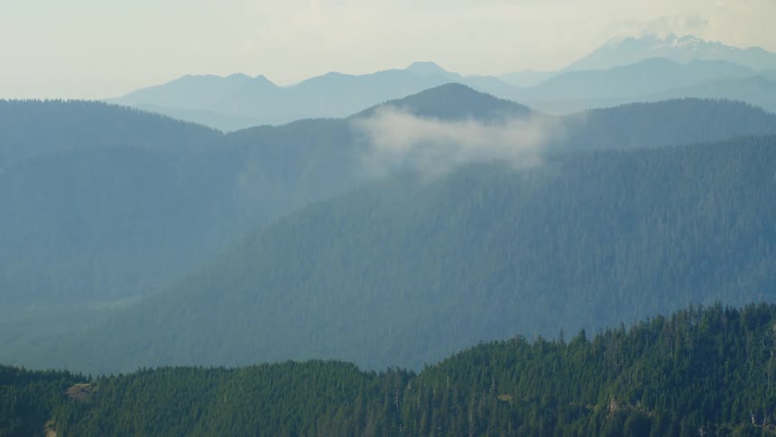 Aerial view of mountains with steep ridges and woods