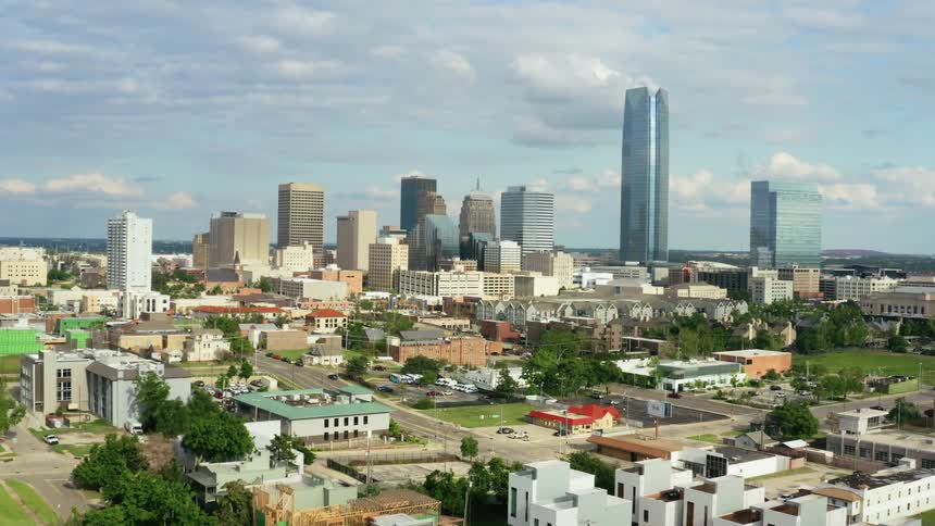 Aerial shot of a city skyline with tall buildings in sight