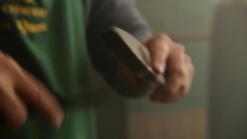 A man sharpening a knife