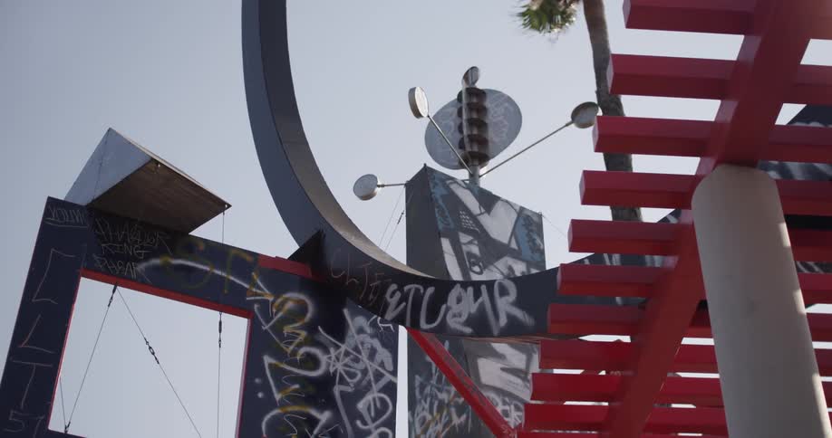Spinning device sitting atop a lot of graffiti