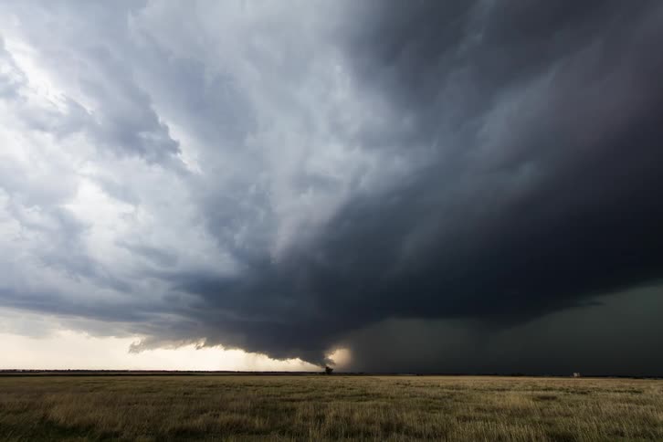 Landscape view of storm clouds over a field