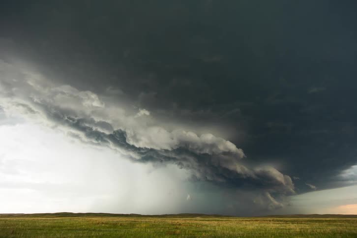 A large storm pours rain on the field