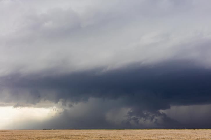 The storm moves across the field