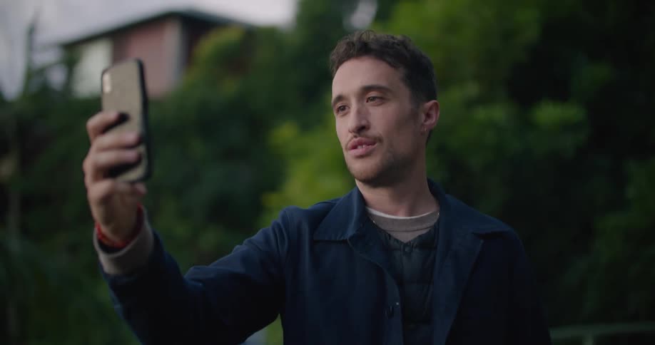 A man talking on a smartphone to someone