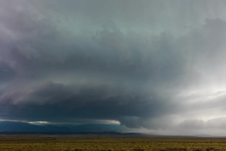 A tornado is forming in the distance