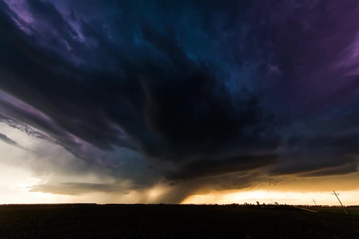 The lightning flashes all over the storm clouds