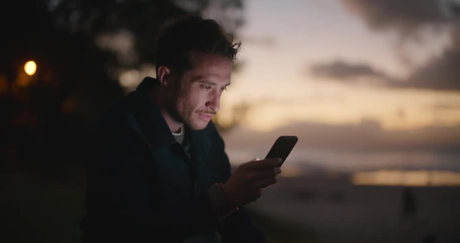 A man is using his cell phone