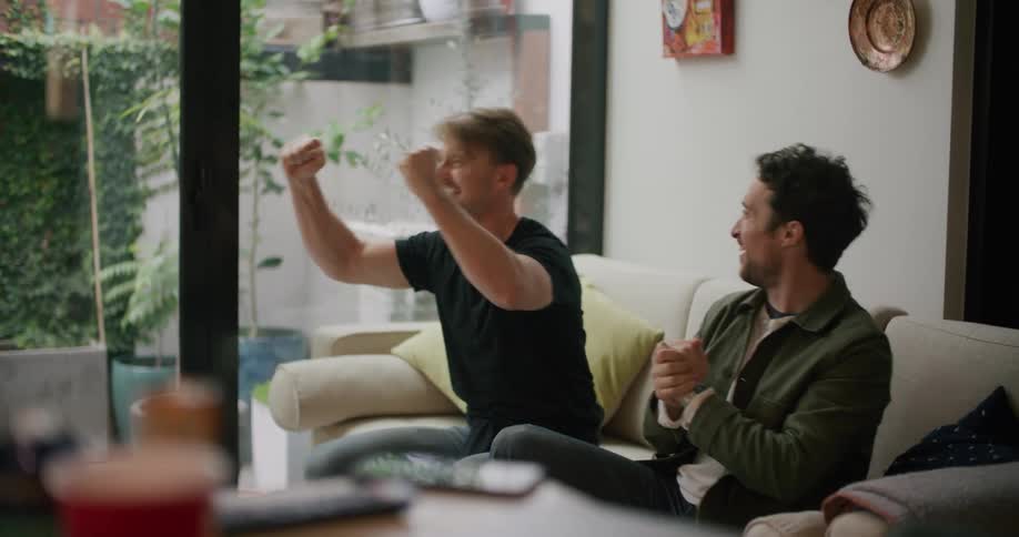 Two men celebrating