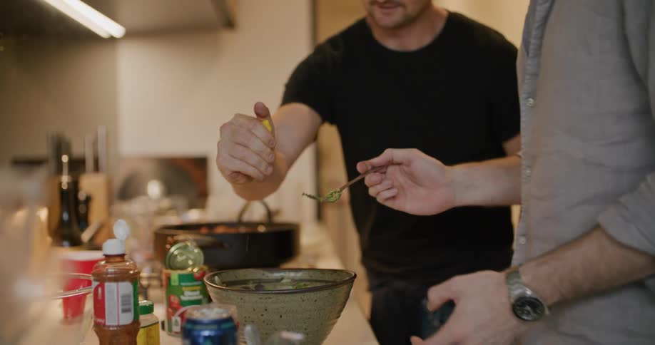 Two men cooking in a kitchen