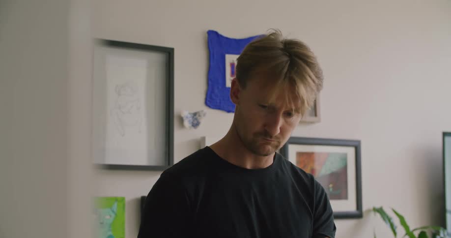A man peeling avocados in a home kitchen