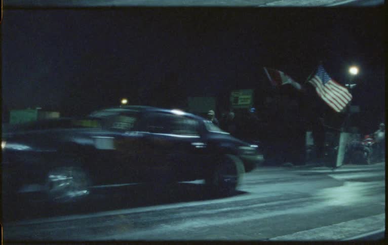 Two cars race together on the track