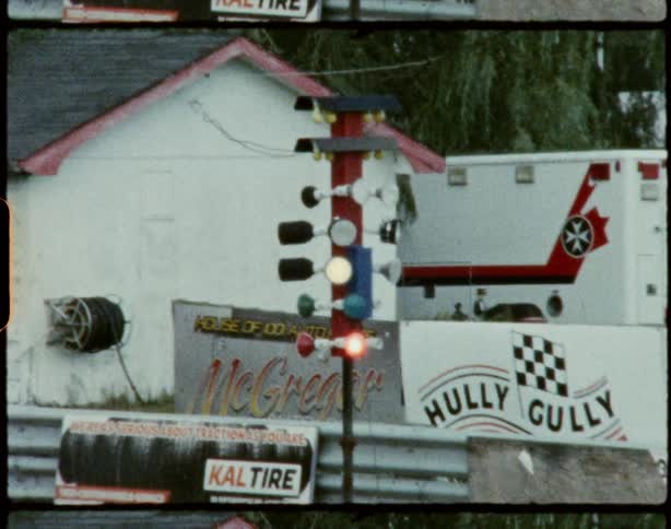 Race cars speeding by on a racetrack