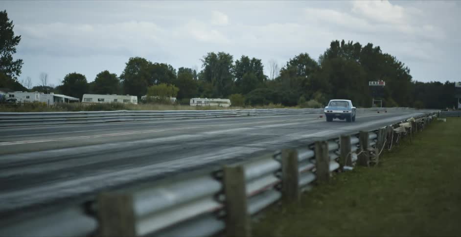 A car races across the track