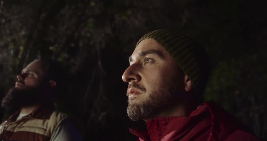Two men standing in a cave