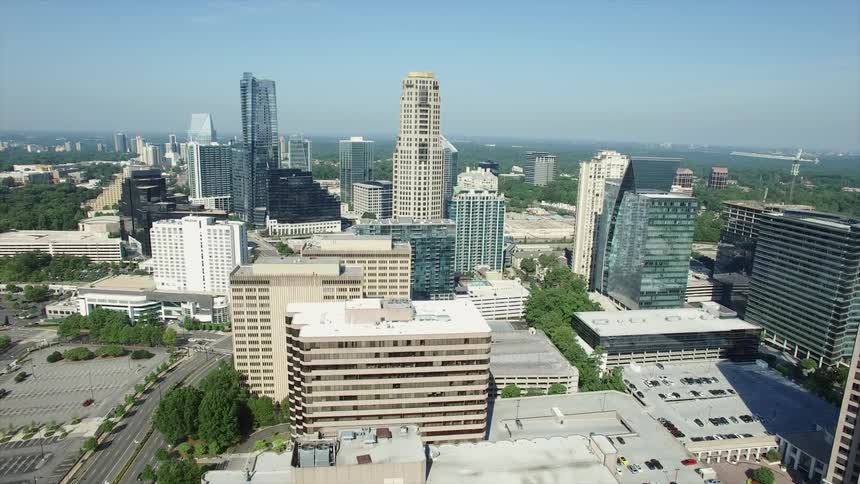 Looking over a city with several tall buildings