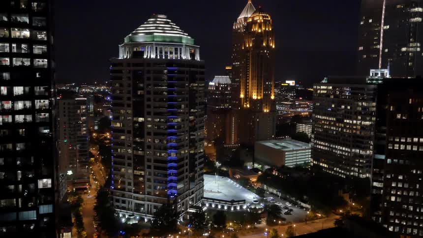 Buildings and skyscrapers in a city at night