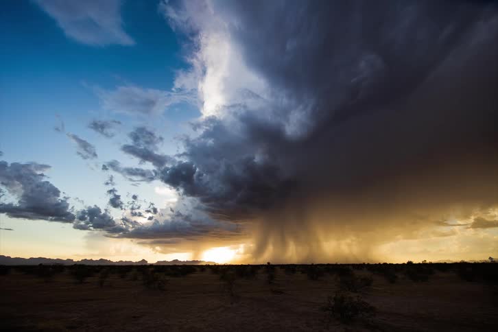 The storm pours water over the fields