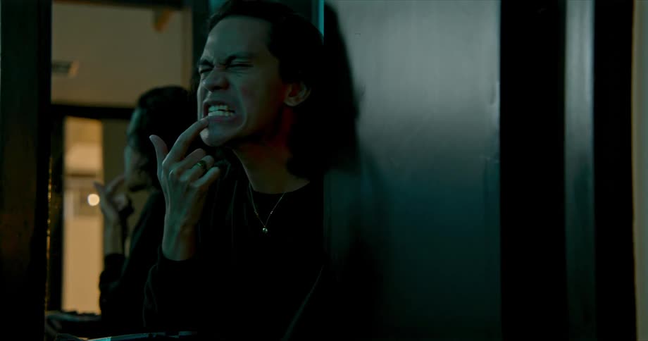 A man brushing something onto his face