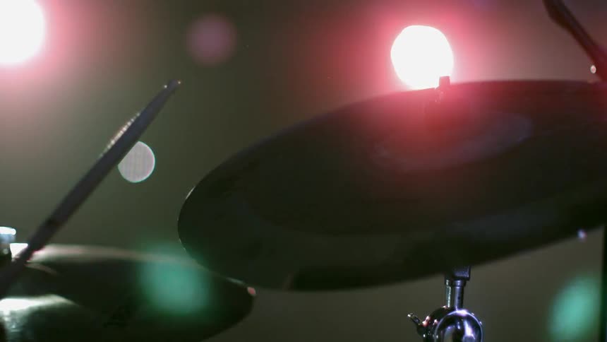 Lights are strobing over a drum set
