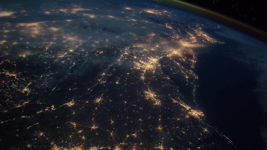 The lights of urban areas illuminated a landmass seen from outer space