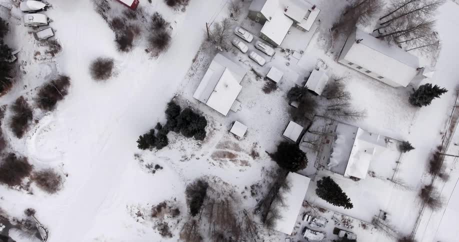Direct overhead view of a snowy suburban area