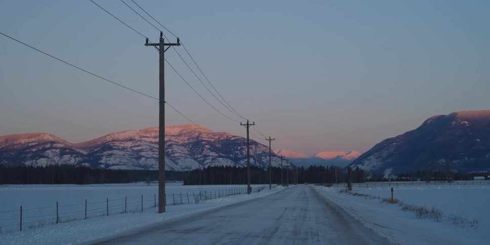 A view of a landscape at sunset