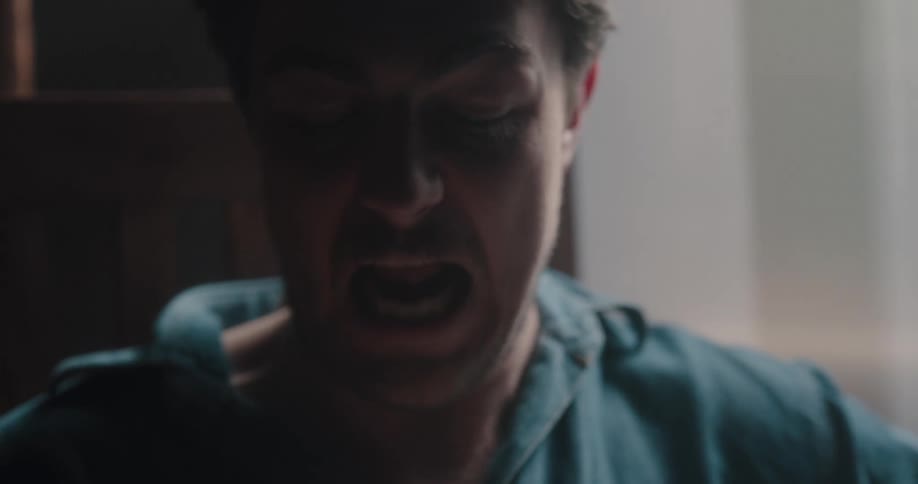 Man pretends to bite anothers digits playfully