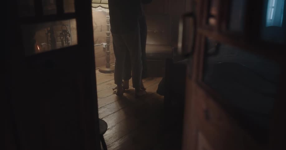 Husband and wife are dancing indoors at night