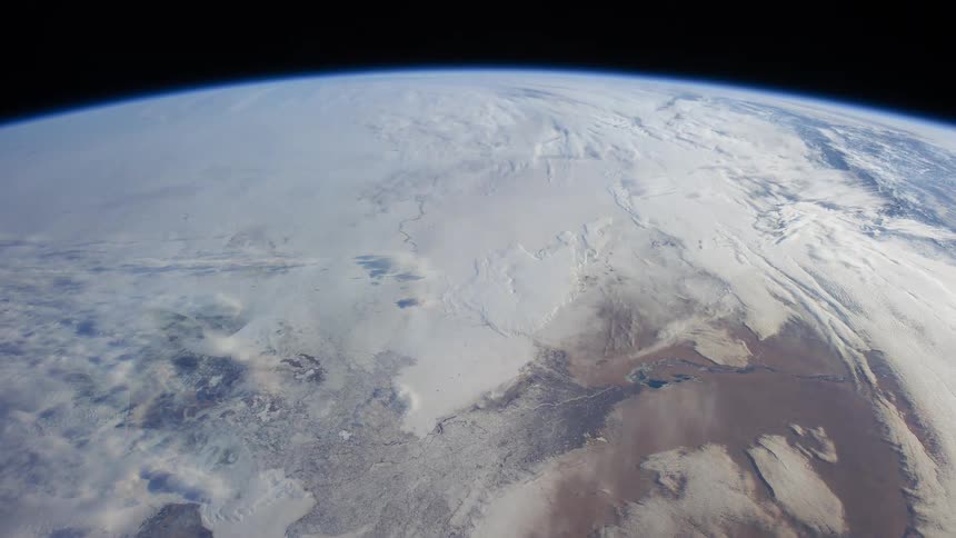 Terrain features flow from ice covered zones to desert green lands ocean and again to ice
