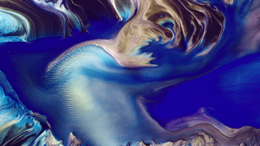 Colored liquid swirls as it blends