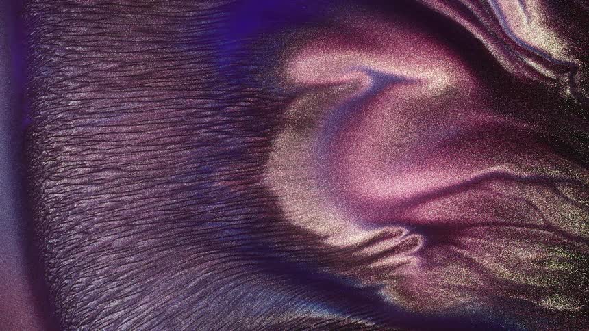 Purple opalescent liquids flow outward