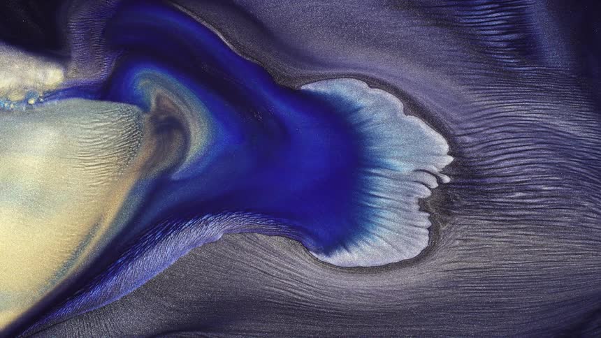 Blue white and gray fluids mix and meld