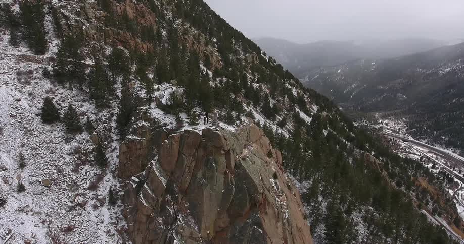 Tall snow and tree covered mountains