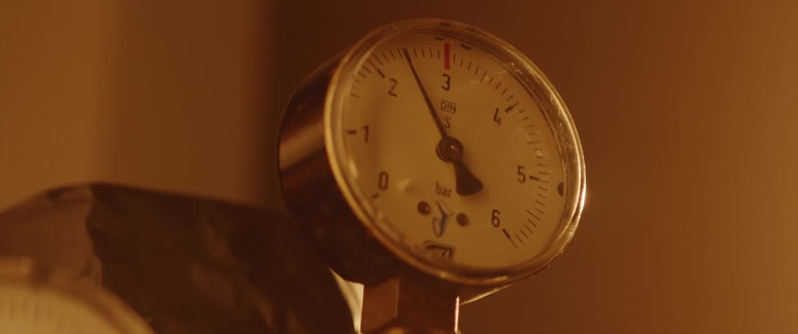A pressure gauge in a room with numbers