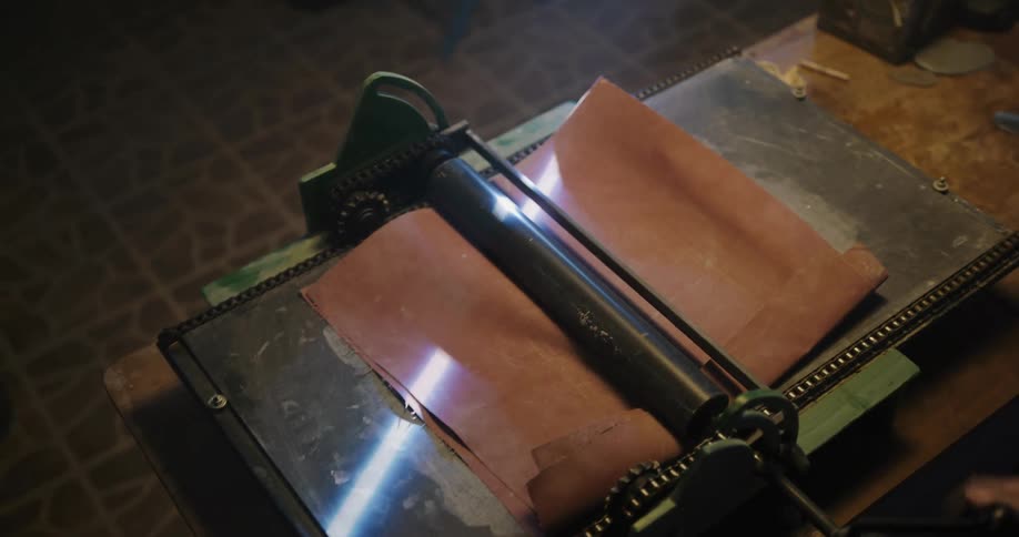 A woman working with clay and a machine