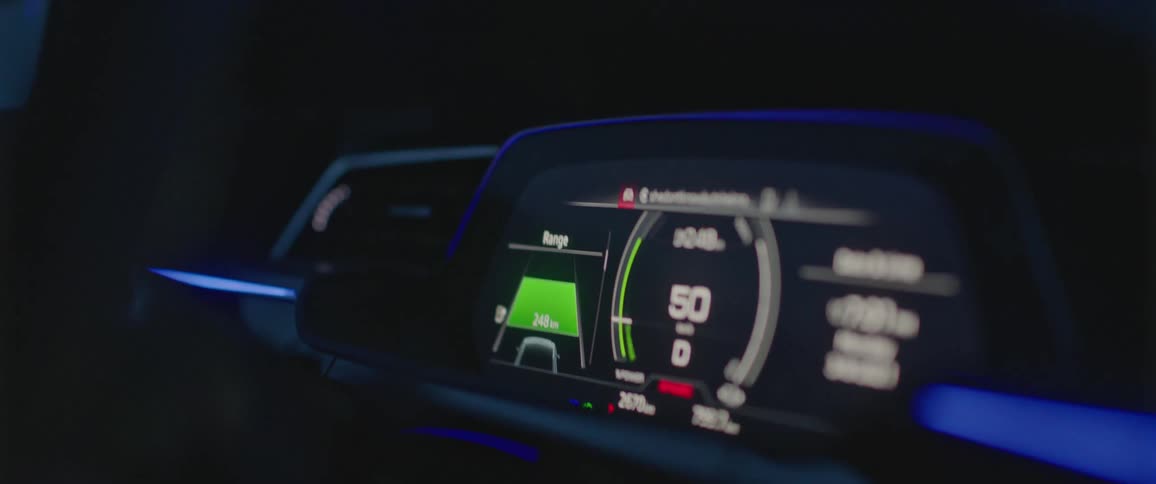 Electronic display on the dashboard of a car driving at night