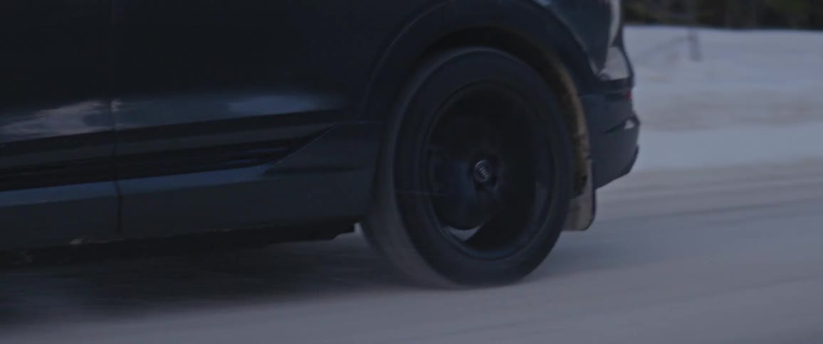 A car driving down a snowy road