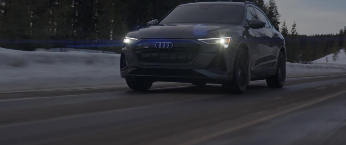 A view of a car driving on a snowy road