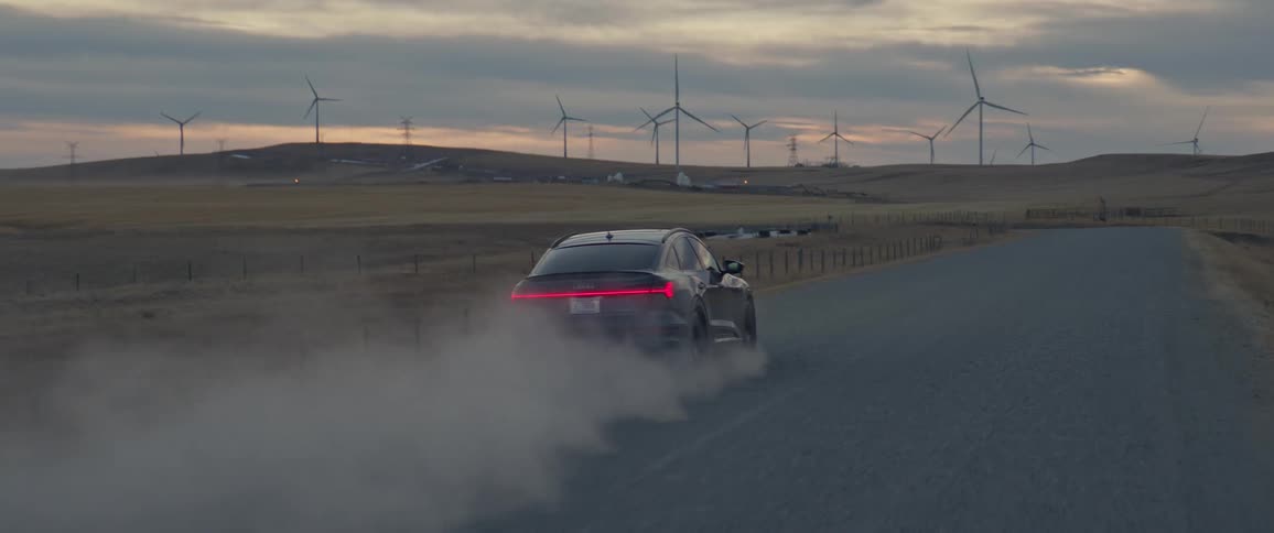 A car driving down a dirt road